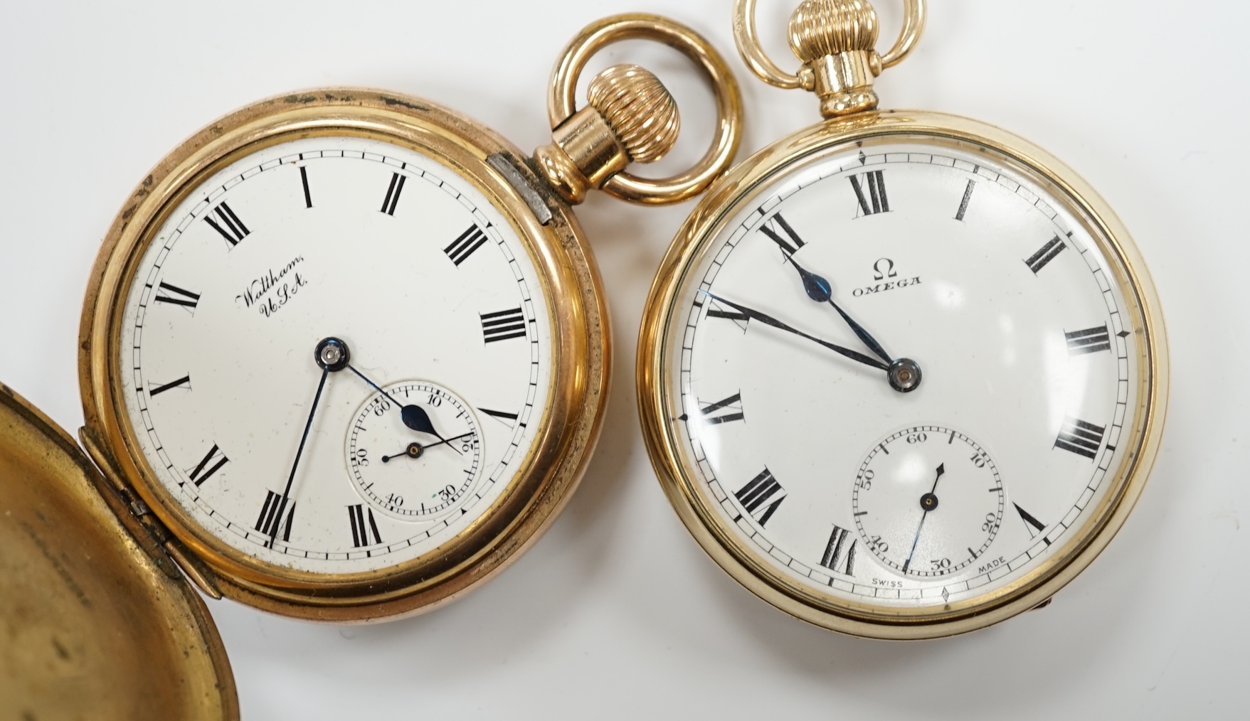 A gold plated Omega open faced pocket watch, with Roman dial and subsidiary seconds and a gold plated Waltham hunter pocket watch.